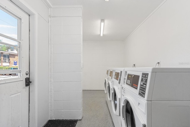 common laundry area featuring ornamental molding and independent washer and dryer