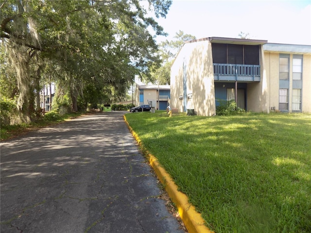 2811 SW Archer Rd Unit W 191, Gainesville, FL 32608 - view of asphalt road with curbs