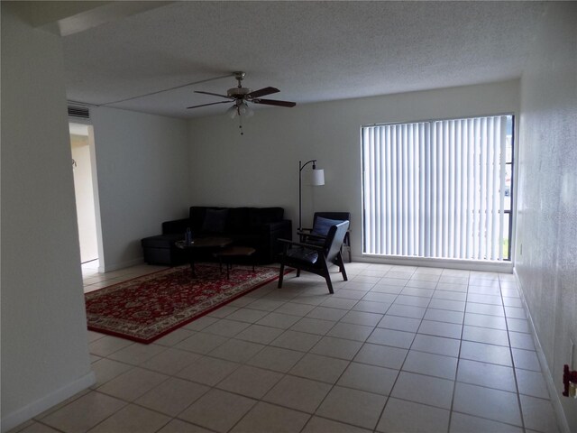 2811 SW Archer Rd Unit W 191, Gainesville, FL 32608 - living room with a ceiling fan and a textured ceiling