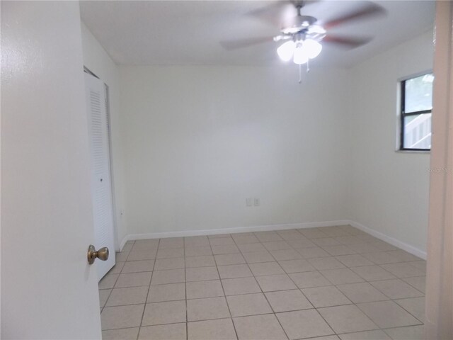 2811 SW Archer Rd Unit W 191, Gainesville, FL 32608 - unfurnished room with a ceiling fan, light tile patterned flooring, and baseboards