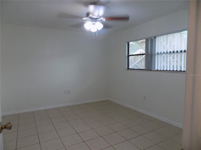 2811 SW Archer Rd Unit W 191, Gainesville, FL 32608 - unfurnished room featuring ceiling fan, light tile patterned flooring, and baseboards
