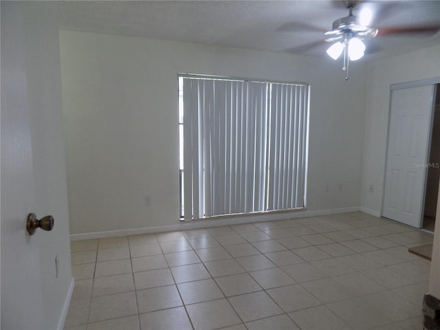 2811 SW Archer Rd Unit W 191, Gainesville, FL 32608 - unfurnished room featuring a ceiling fan, light tile patterned flooring, and baseboards