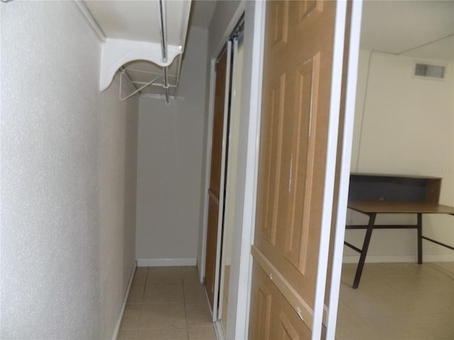 2811 SW Archer Rd Unit W 191, Gainesville, FL 32608 - hall featuring light tile patterned floors and baseboards