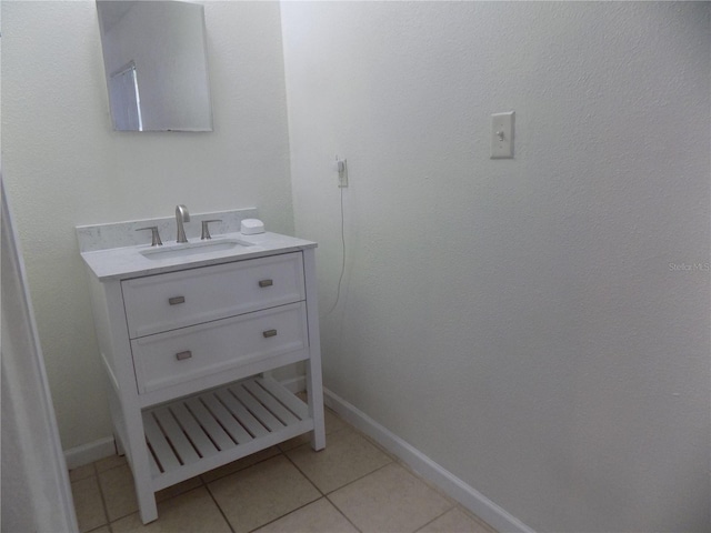 2811 SW Archer Rd Unit W 191, Gainesville, FL 32608 - bathroom featuring tile patterned flooring, baseboards, and vanity