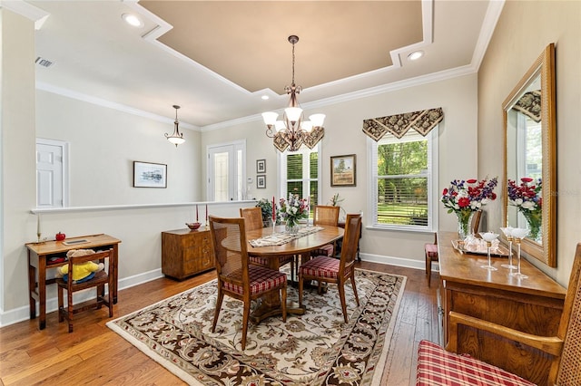 19138 NW 76th Ave, Alachua, FL 32615 - dining space featuring a notable chandelier, recessed lighting, baseboards, wood-type flooring, and crown molding