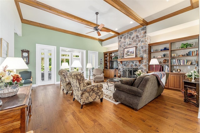19138 NW 76th Ave, Alachua, FL 32615 - living room with a stone fireplace, wood-type flooring, ceiling fan, crown molding, and beam ceiling
