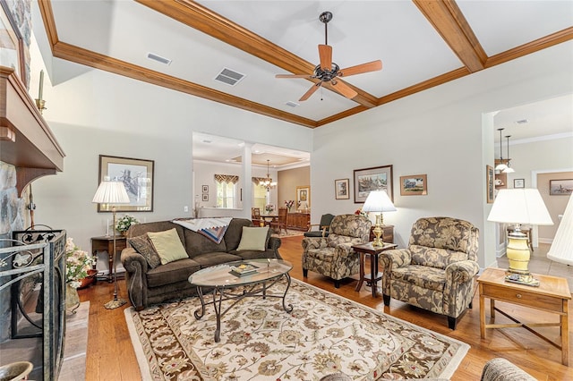 19138 NW 76th Ave, Alachua, FL 32615 - living room featuring crown molding, ceiling fan with notable chandelier, visible vents, and light wood-style floors