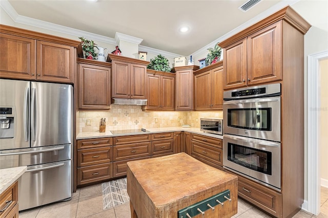 19138 NW 76th Ave, Alachua, FL 32615 - kitchen featuring ornamental molding, tasteful backsplash, visible vents, and appliances with stainless steel finishes
