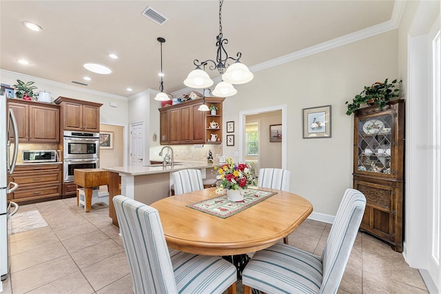 19138 NW 76th Ave, Alachua, FL 32615 - dining area featuring light tile patterned floors, recessed lighting, ornamental molding, and visible vents