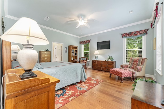 19138 NW 76th Ave, Alachua, FL 32615 - bedroom featuring light wood-type flooring, ceiling fan, ornamental molding, and visible vents