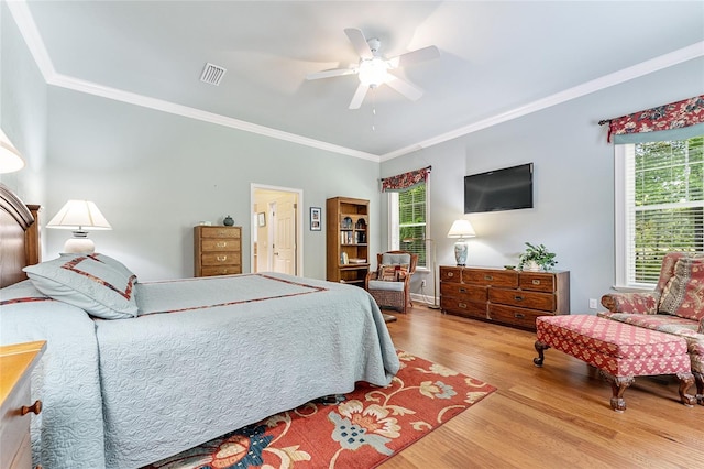 19138 NW 76th Ave, Alachua, FL 32615 - bedroom with ornamental molding, visible vents, multiple windows, and wood finished floors