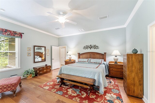 19138 NW 76th Ave, Alachua, FL 32615 - bedroom with ornamental molding, light wood-type flooring, and visible vents