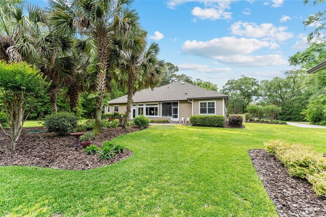19138 NW 76th Ave, Alachua, FL 32615 - back of property with a yard and roof with shingles