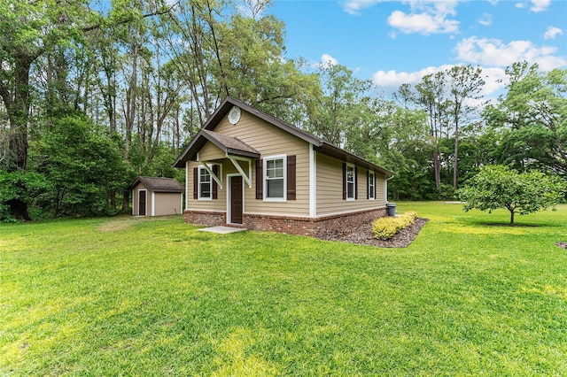 19138 NW 76th Ave, Alachua, FL 32615 - view of front facade with a storage shed, an outdoor structure, and a front lawn