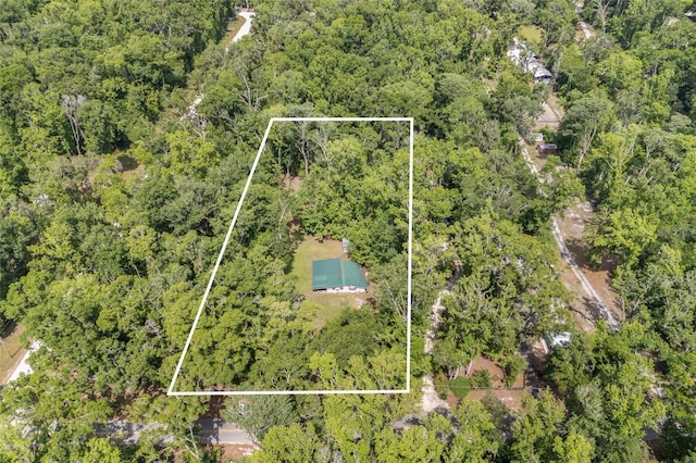 drone / aerial view with a view of trees