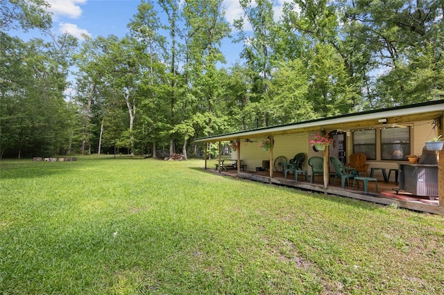 view of yard featuring a wooden deck