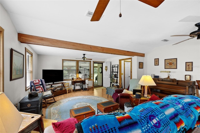living room with ceiling fan, beam ceiling, wood finished floors, and visible vents