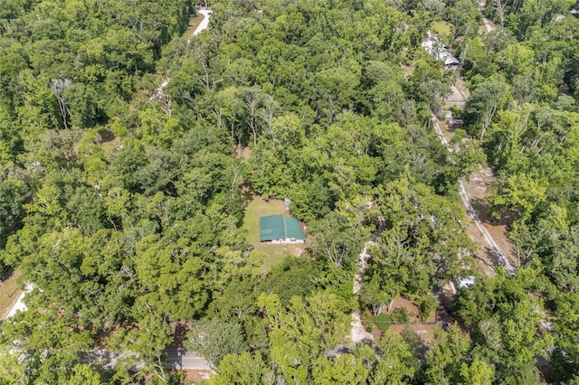 drone / aerial view featuring a view of trees