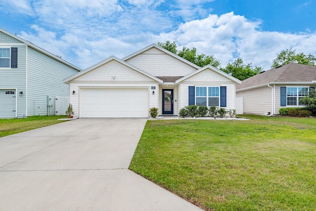 ranch-style home featuring concrete driveway, a front yard, and a garage