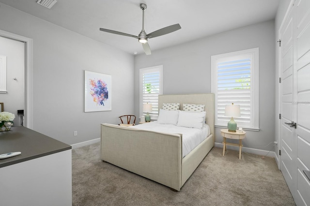 bedroom with carpet, baseboards, and a ceiling fan