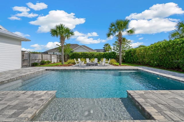view of pool featuring a patio area and an outdoor fire pit