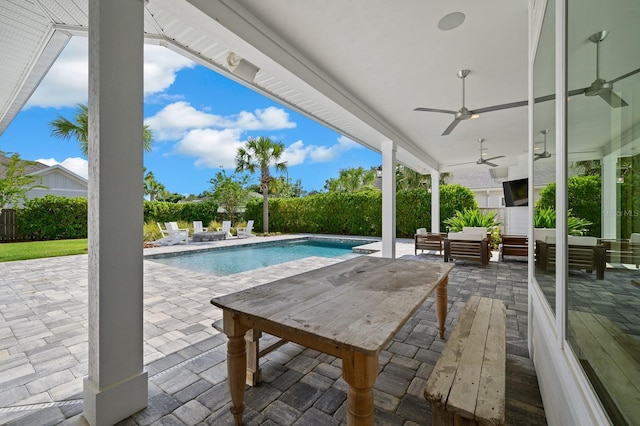 view of pool featuring a patio, an outdoor living space, ceiling fan, and a fenced backyard