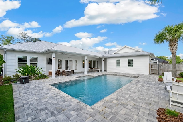 back of house with a ceiling fan, a patio, fence, metal roof, and french doors