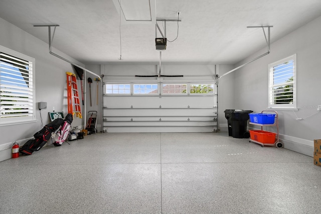 garage featuring a garage door opener