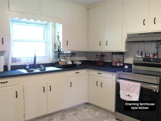 kitchen with a sink, dark countertops, white cabinets, stainless steel electric stove, and under cabinet range hood