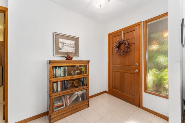 7022 NW 51st Ter, Gainesville, FL 32653 - foyer featuring baseboards and light tile patterned flooring