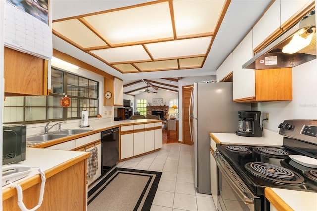 7022 NW 51st Ter, Gainesville, FL 32653 - kitchen with a sink, a fireplace, black appliances, under cabinet range hood, and light countertops