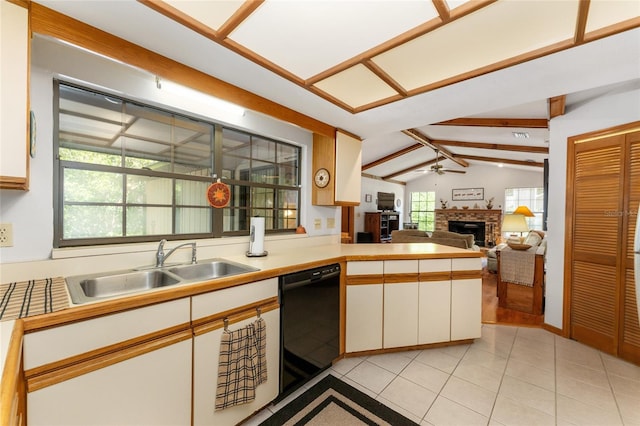 7022 NW 51st Ter, Gainesville, FL 32653 - kitchen with light tile patterned floors, a sink, black dishwasher, a fireplace, and vaulted ceiling with beams