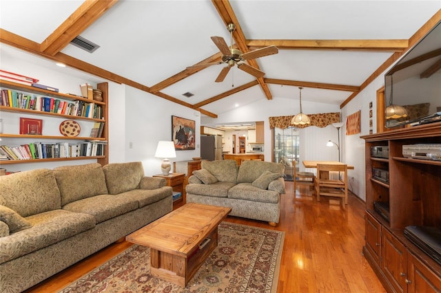 7022 NW 51st Ter, Gainesville, FL 32653 - living room with light wood-style flooring, lofted ceiling with beams, a ceiling fan, and visible vents
