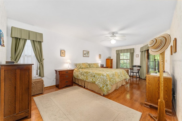 7022 NW 51st Ter, Gainesville, FL 32653 - bedroom with ceiling fan and light wood-style floors