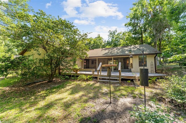 7022 NW 51st Ter, Gainesville, FL 32653 - rear view of property with a wooden deck