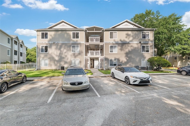 4000 SW 23rd St Unit 2-305, Gainesville, FL 32608 - view of building exterior featuring uncovered parking