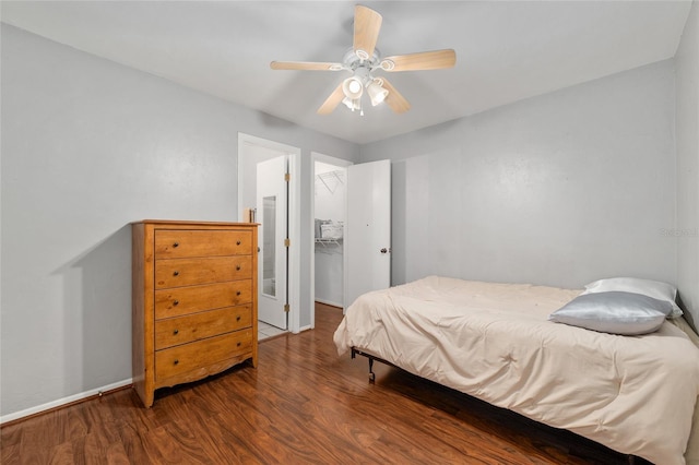 4000 SW 23rd St Unit 2-305, Gainesville, FL 32608 - bedroom featuring wood finished floors, a ceiling fan, a spacious closet, and a closet