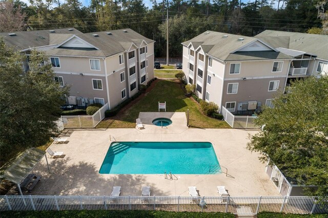 4000 SW 23rd St Unit 2-305, Gainesville, FL 32608 - community pool featuring a fenced backyard and a patio