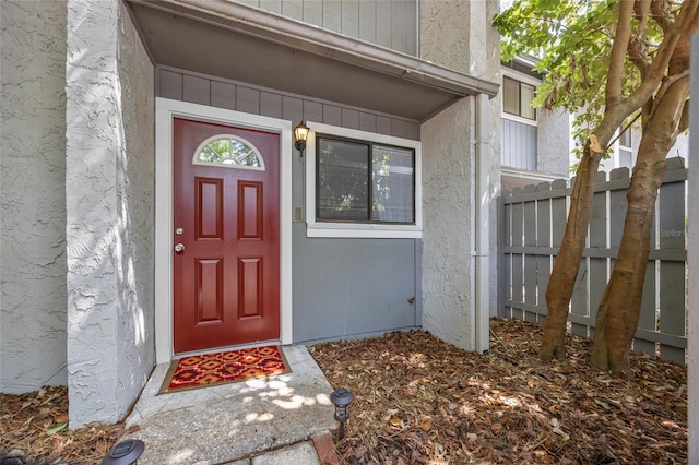 property entrance featuring fence