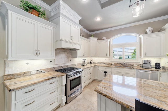 kitchen with stainless steel appliances, decorative backsplash, white cabinetry, ornamental molding, and recessed lighting