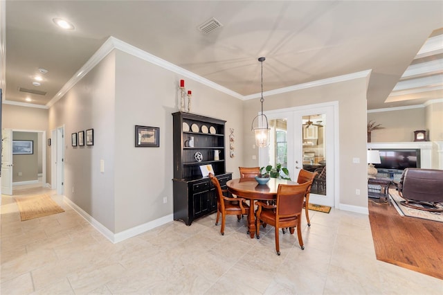 dining space with crown molding, baseboards, and recessed lighting