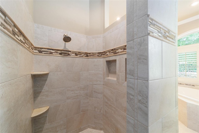 full bathroom with a tile shower