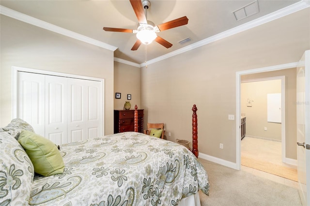 bedroom featuring light colored carpet, a closet, ornamental molding, a ceiling fan, and baseboards