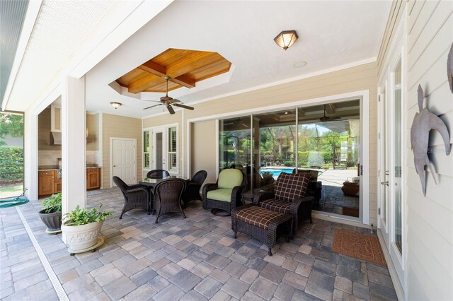 view of patio featuring ceiling fan and outdoor dining area