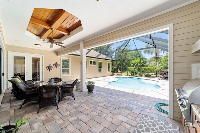 outdoor pool with a grill, a patio area, french doors, a lanai, and a ceiling fan