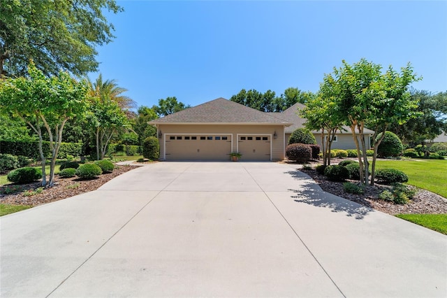view of front of house with driveway and a garage