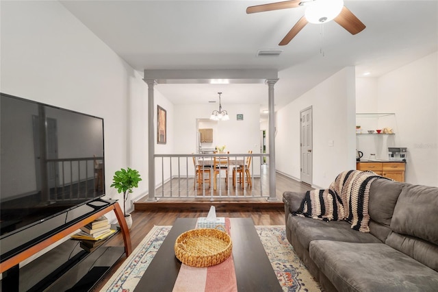 938 NW 42nd Ter, Gainesville, FL 32605 - living area with decorative columns, wood finished floors, and a ceiling fan