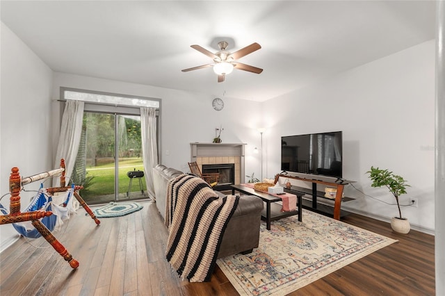 938 NW 42nd Ter, Gainesville, FL 32605 - living area with ceiling fan, wood finished floors, and a tiled fireplace