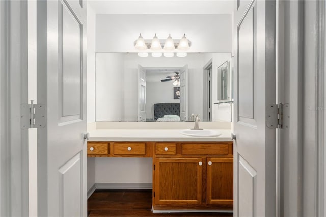 938 NW 42nd Ter, Gainesville, FL 32605 - ensuite bathroom featuring vanity, wood finished floors, and a ceiling fan
