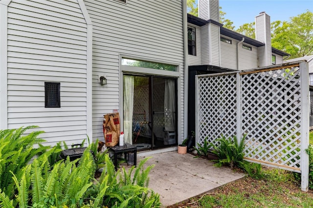 938 NW 42nd Ter, Gainesville, FL 32605 - doorway to property featuring a patio